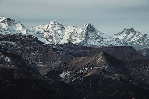 mountain range gray and brown mountains alps